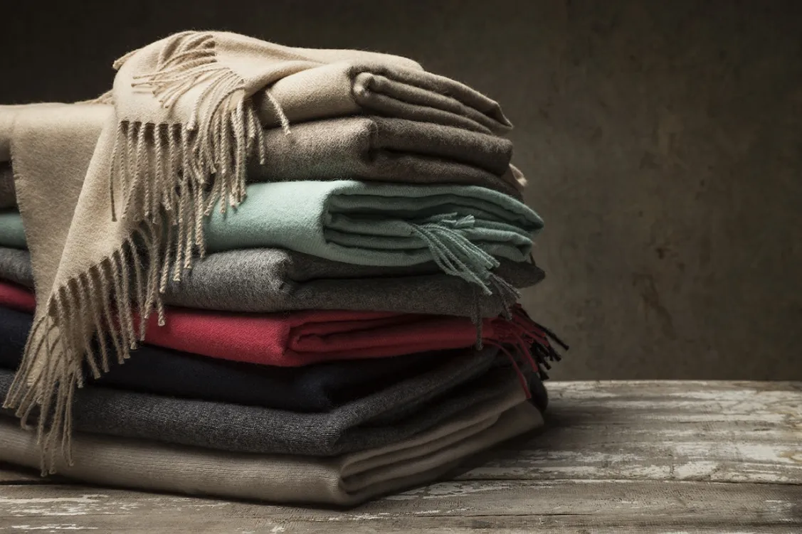 Folded wool throws in muted autumn tones